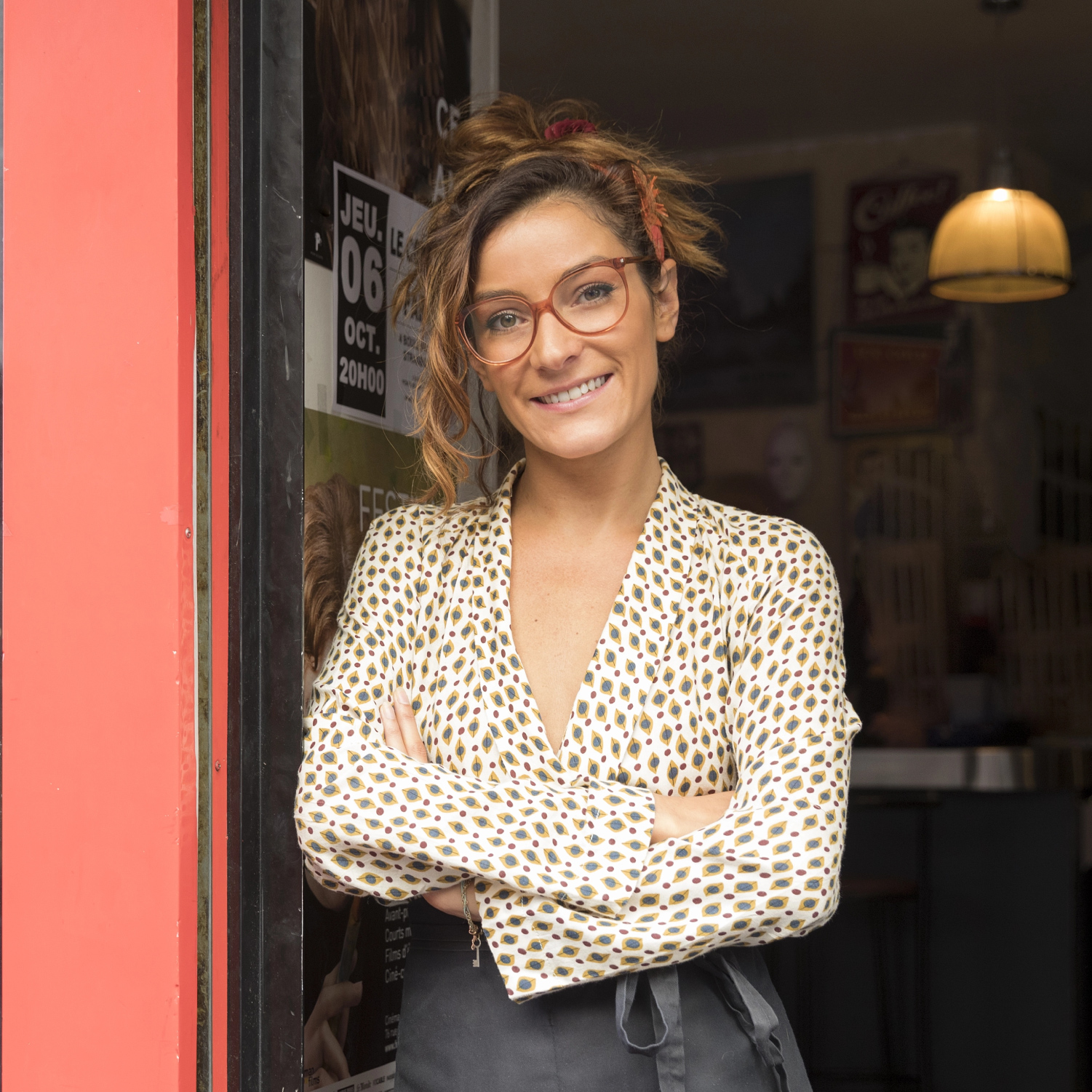 Woman standing outside a cafe